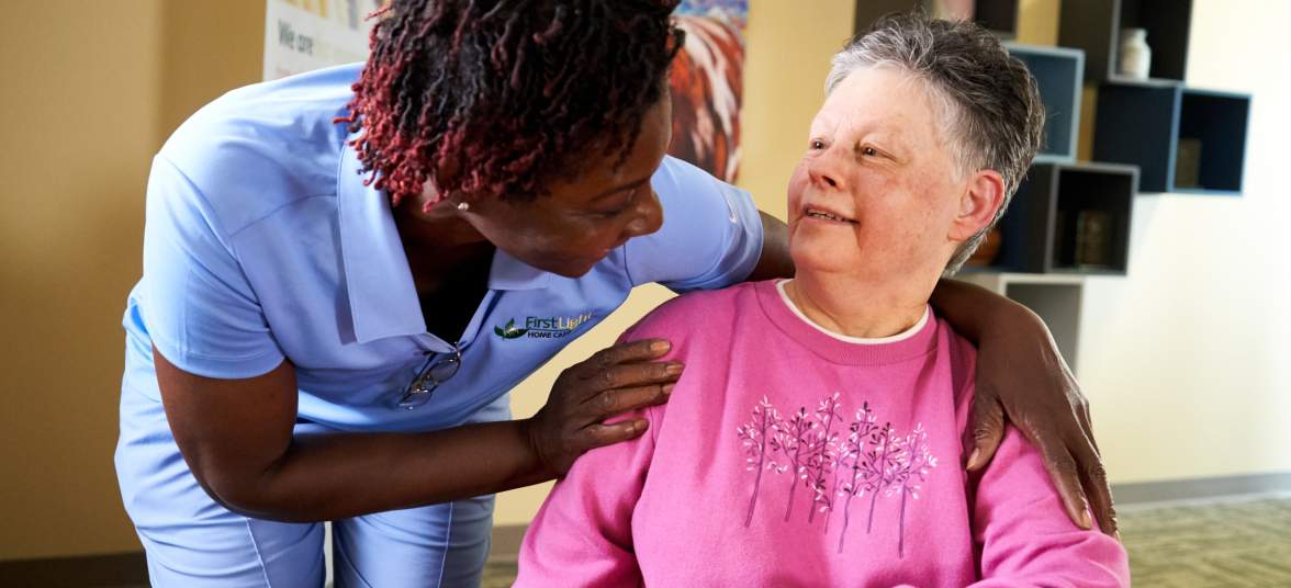 FirstLight client Paula M., with caregiver Cynthia