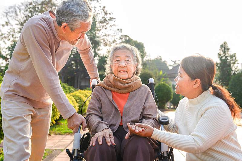 Children discuss home care with their elderly mother