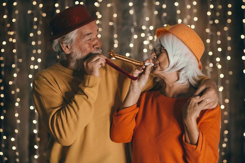 elderly couple celebrating new years